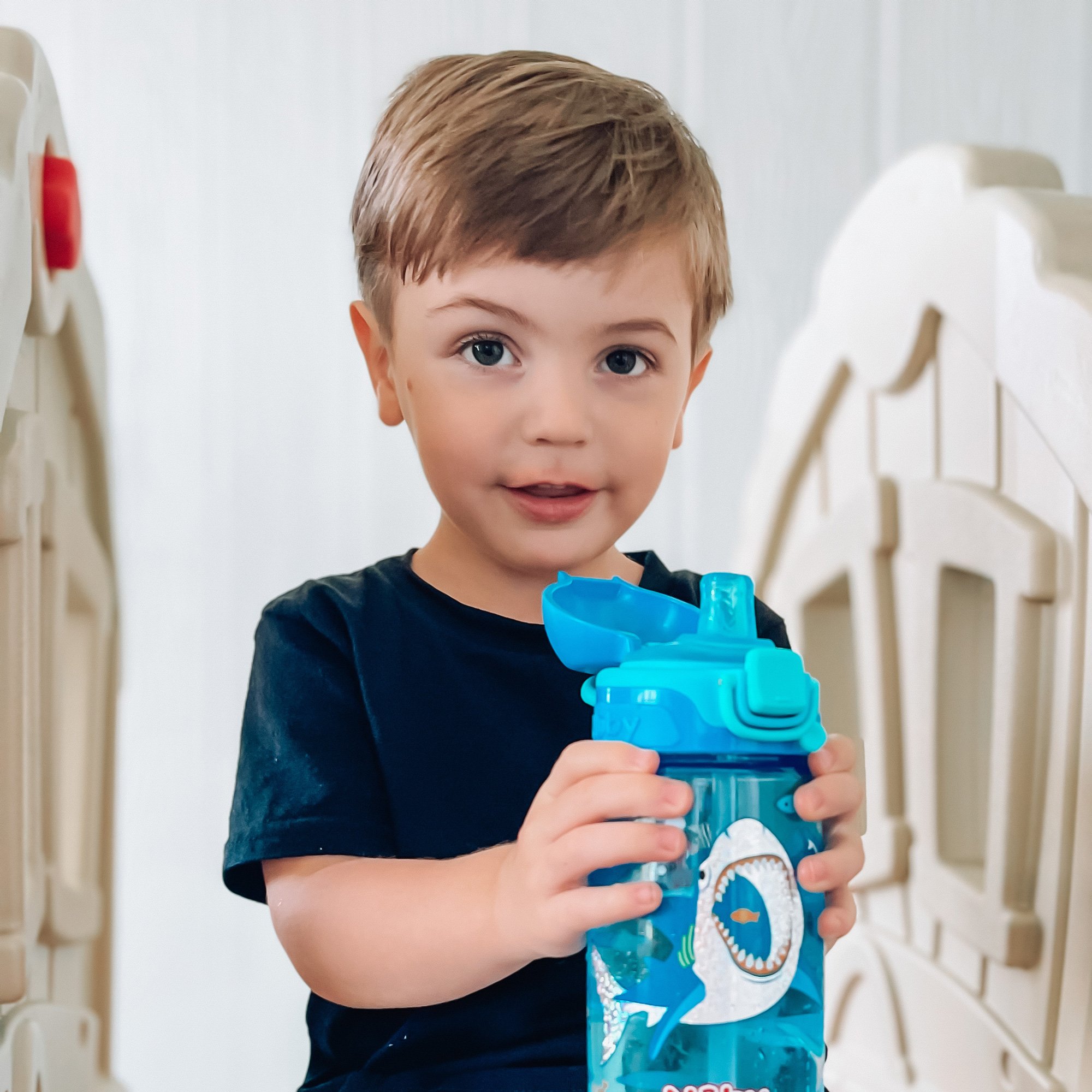 Child holding a cup