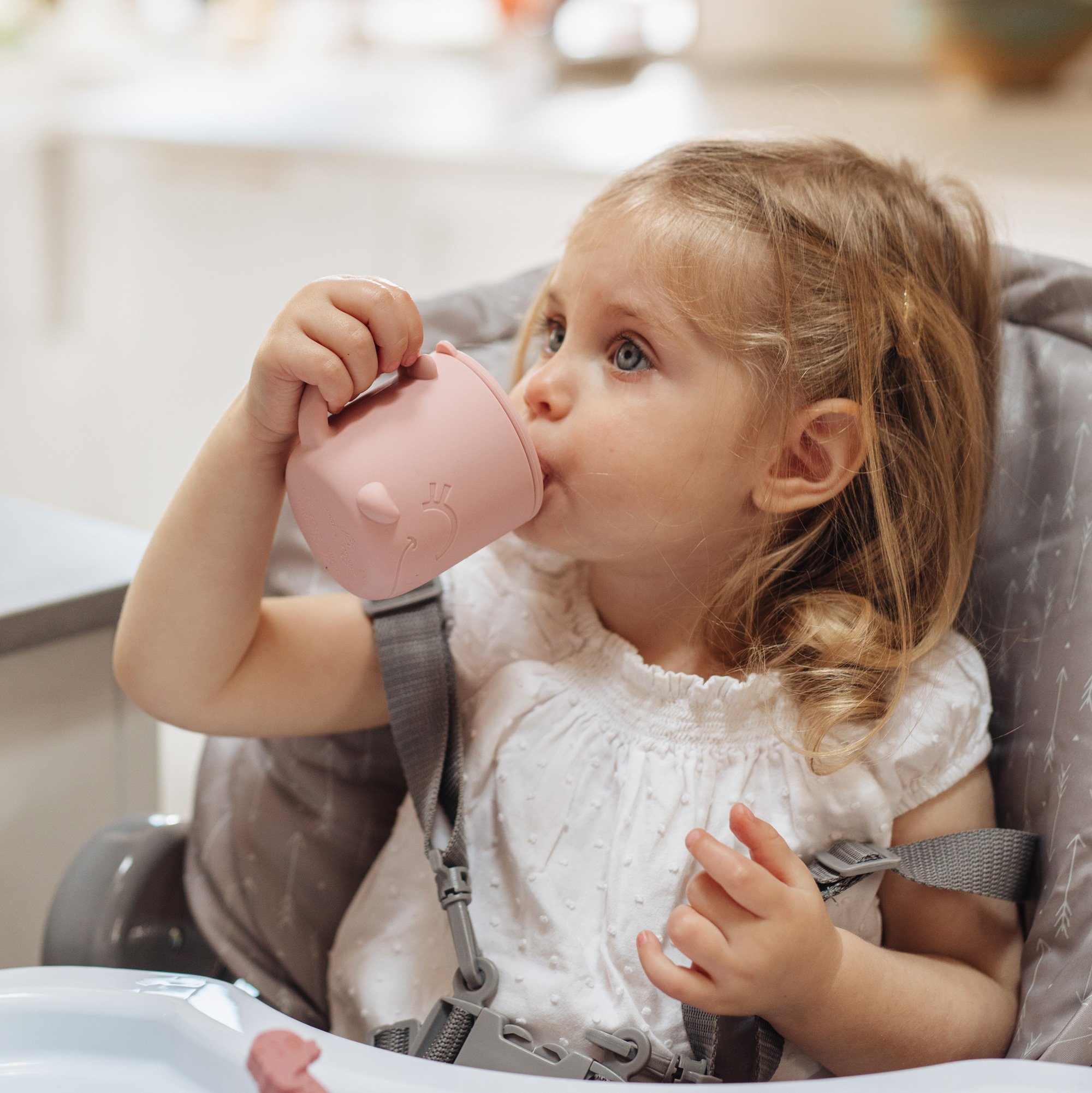 Kid drinking from sippy cup