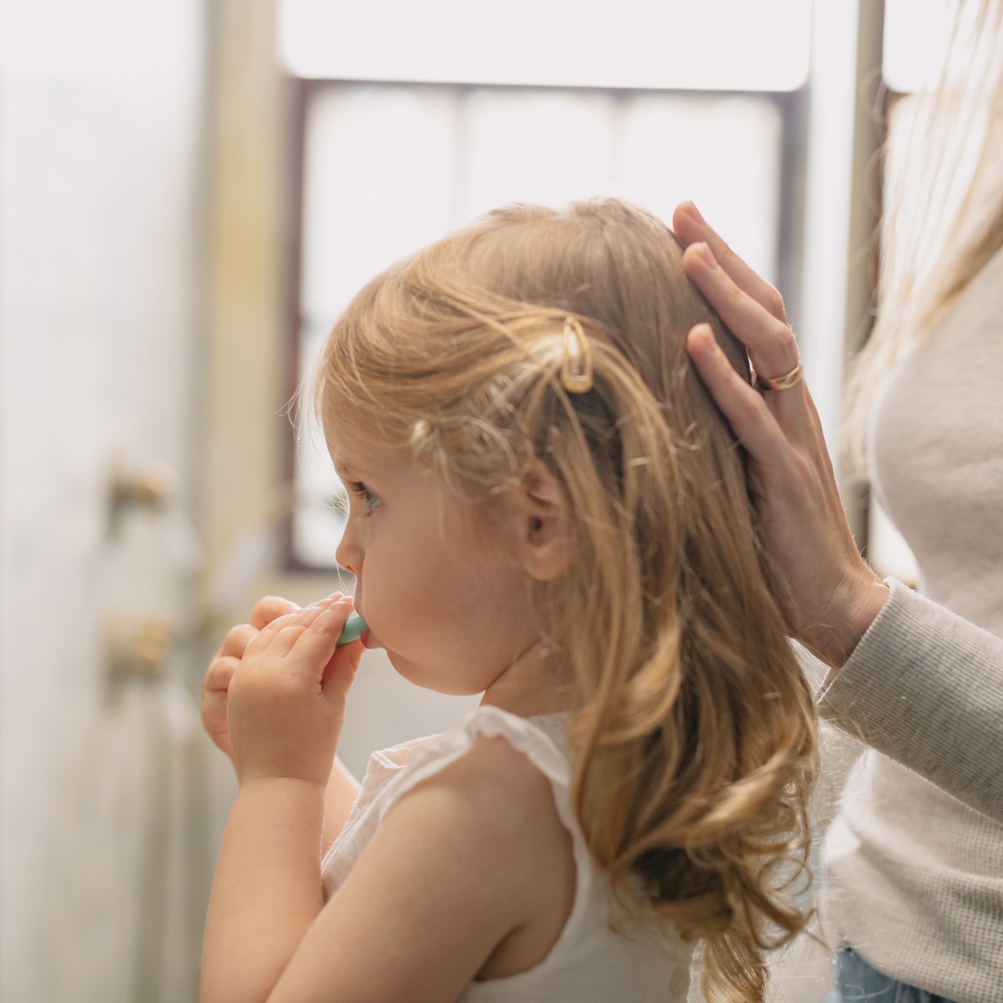 Girl brushing teeth