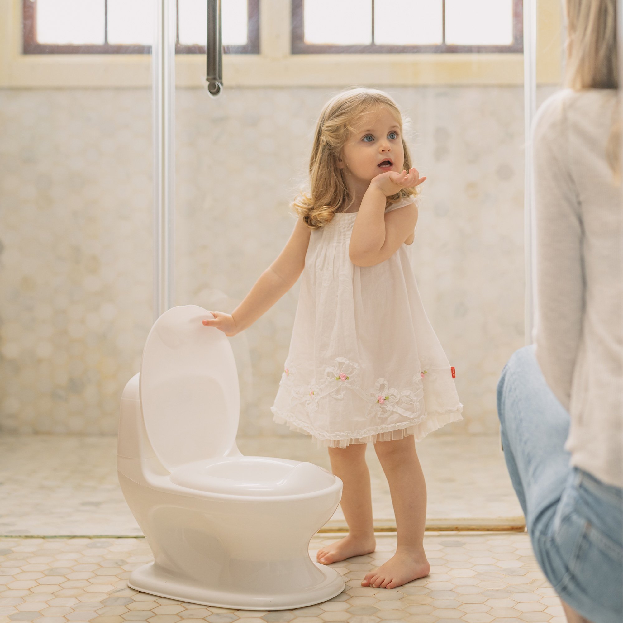 Toddler potty training with the Nuby My Real Potty Training Toilet with Life-Like Flush Button & Sound.