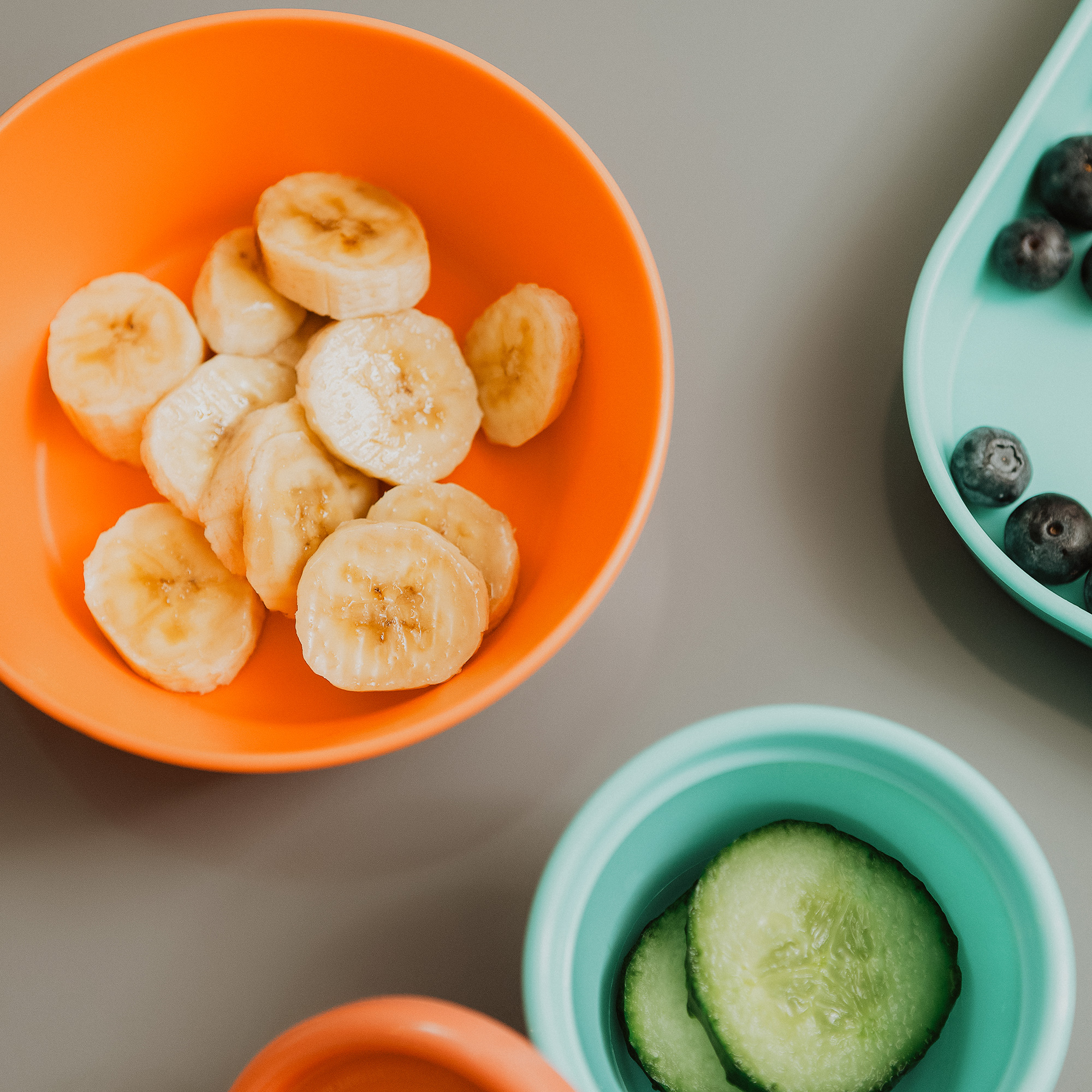 Fruit and vegetables in Nuby plates and bowls for kids.