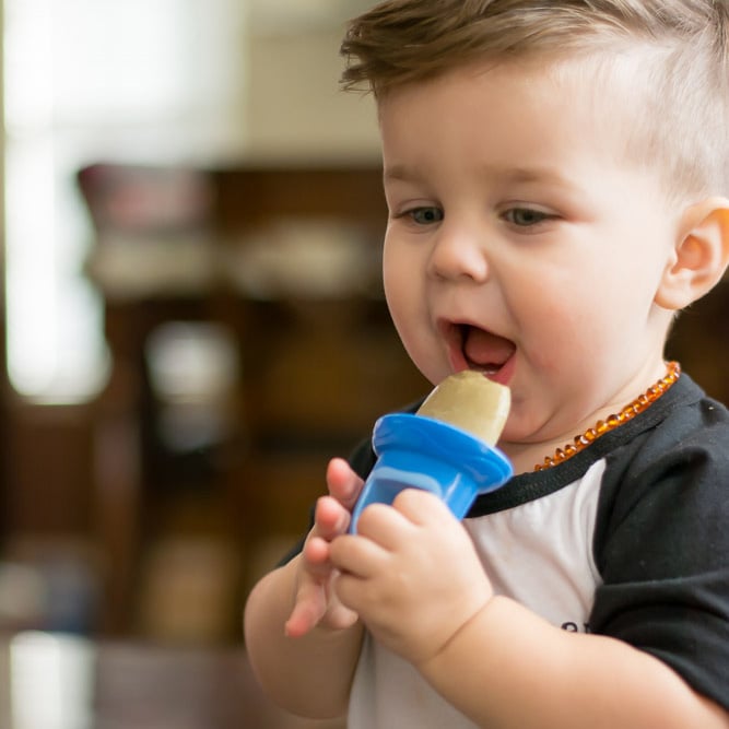 toddler eating a popsicle