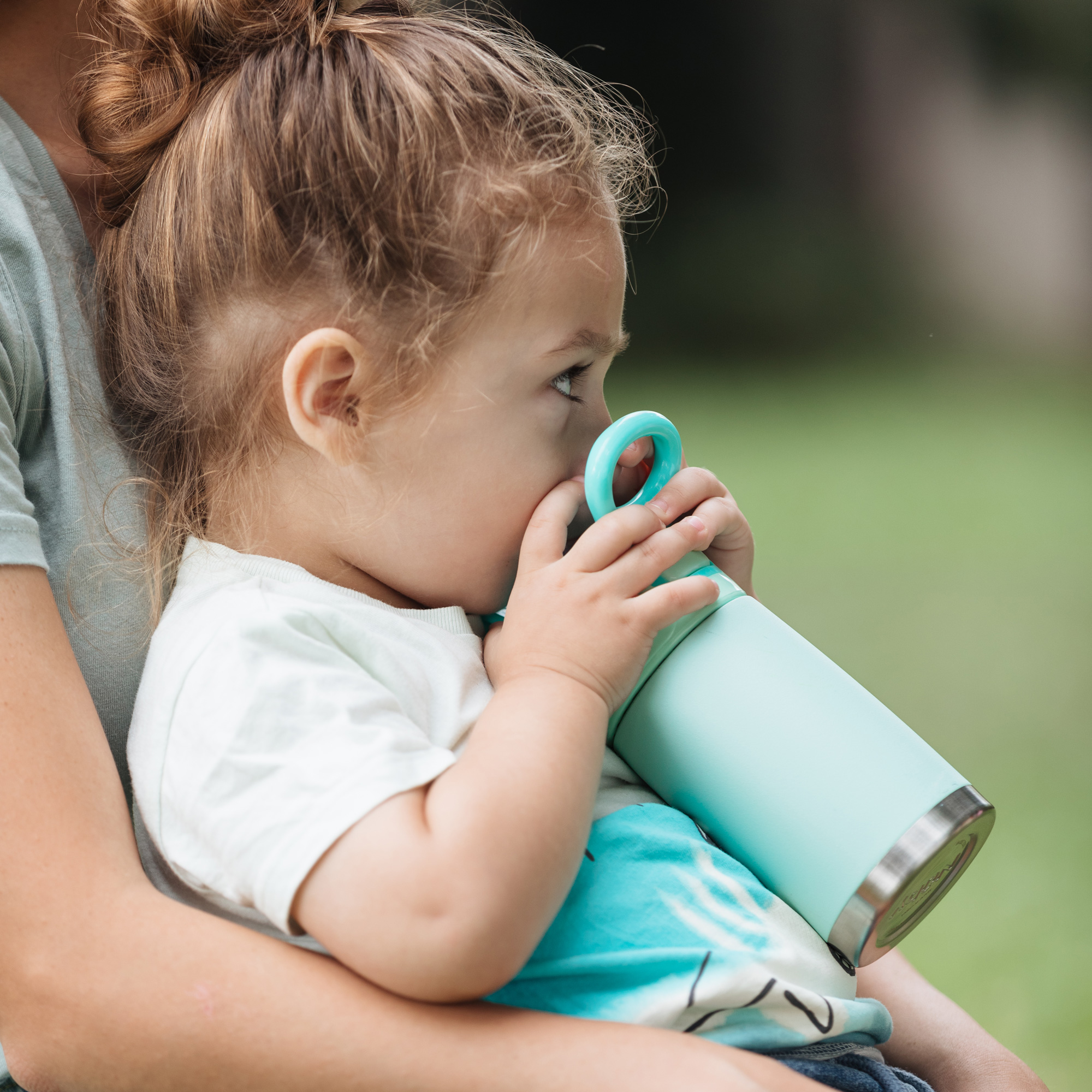 toddler drinking from bottle