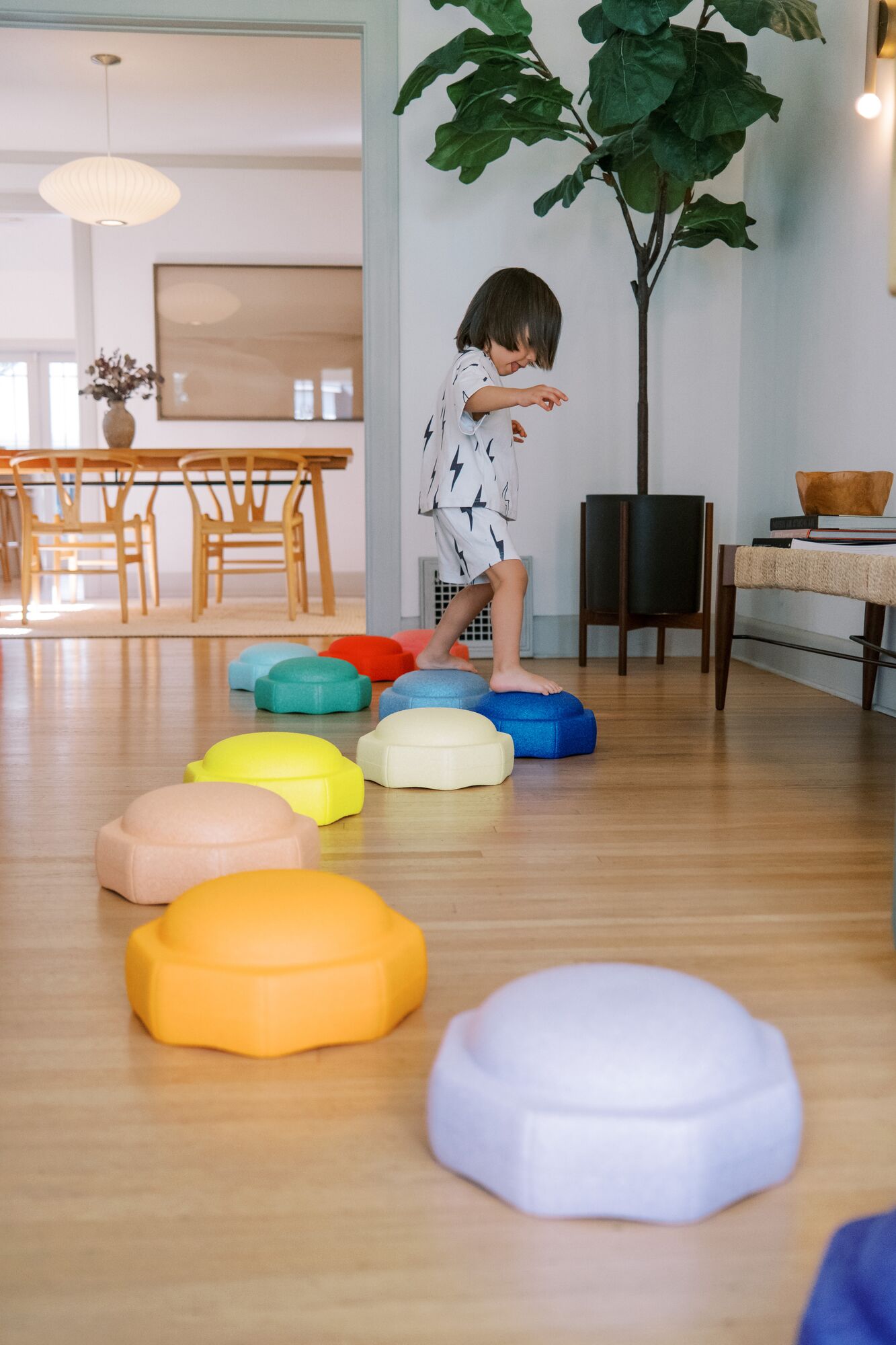 Child playing inside with Nuby StepPebbles.