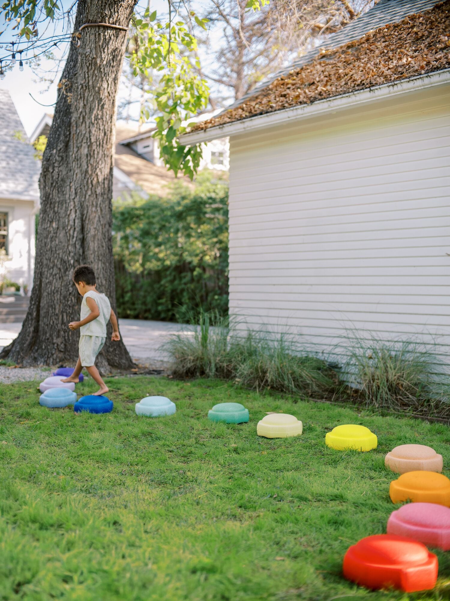 Child playing outside with Nuby StepPebbles.