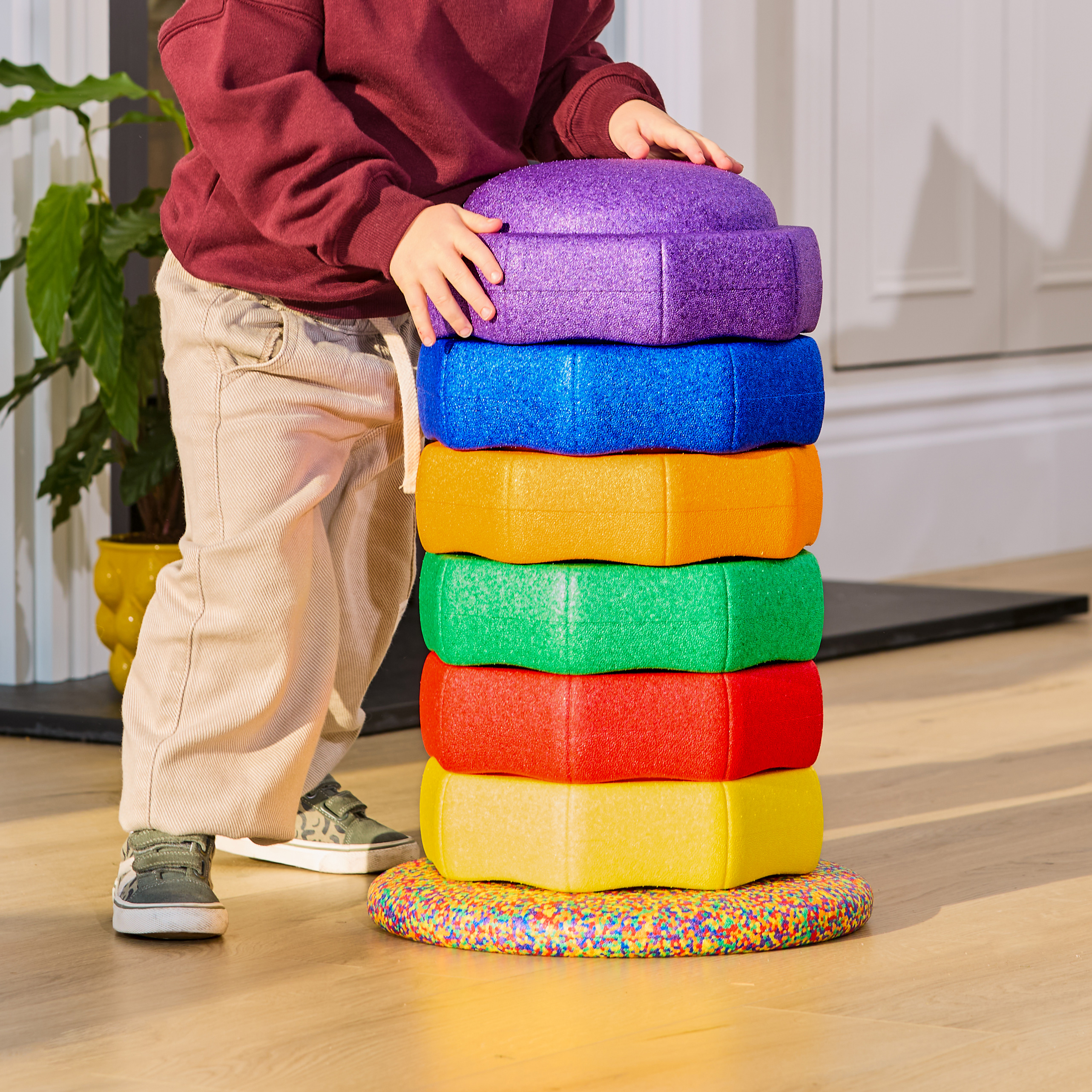 boy playing with Nuby StepPebbles