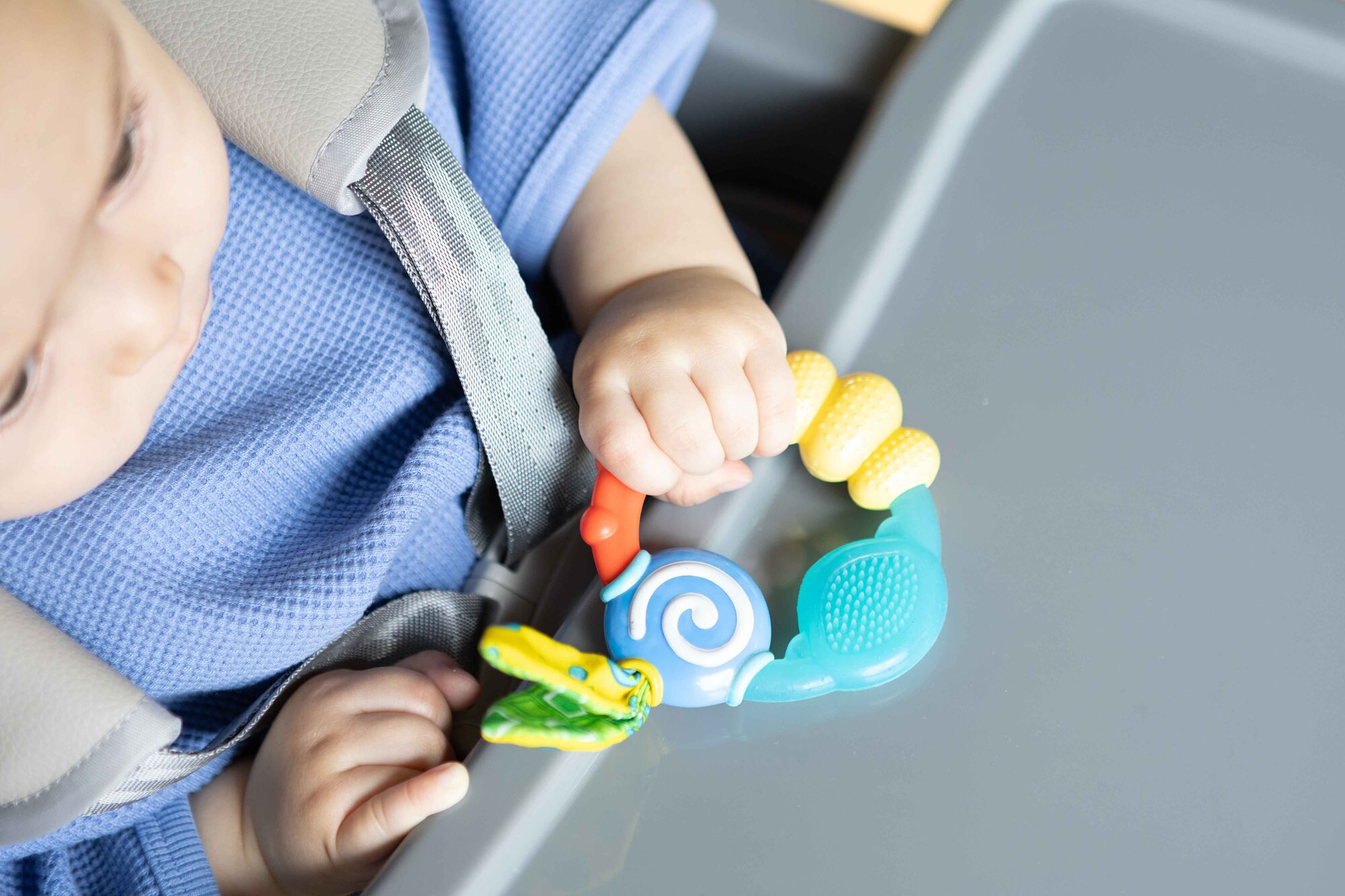 Baby holding teething ring