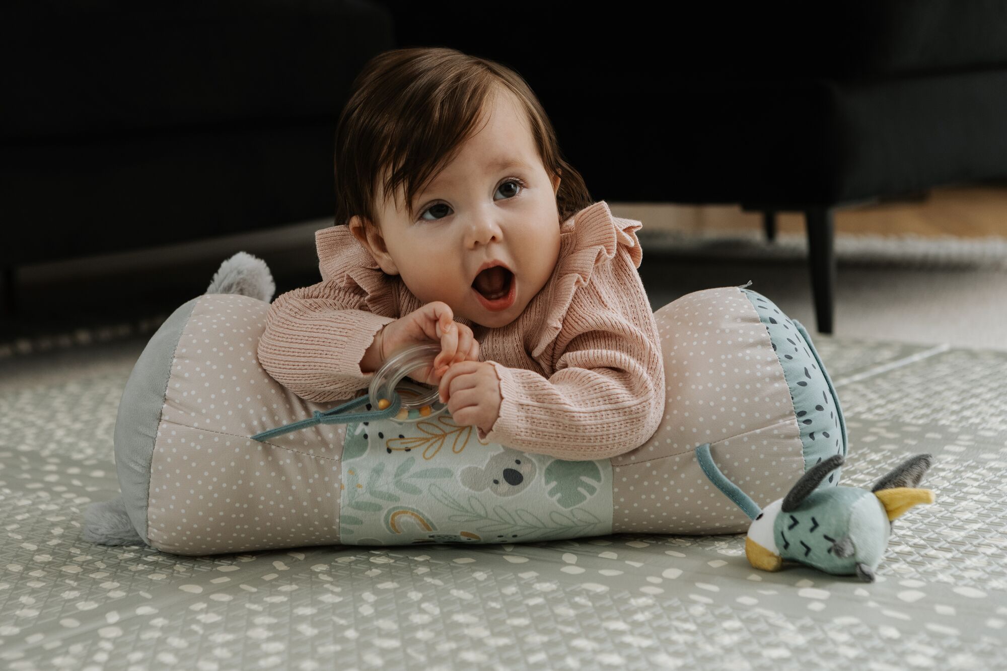 Baby using tummy time roller