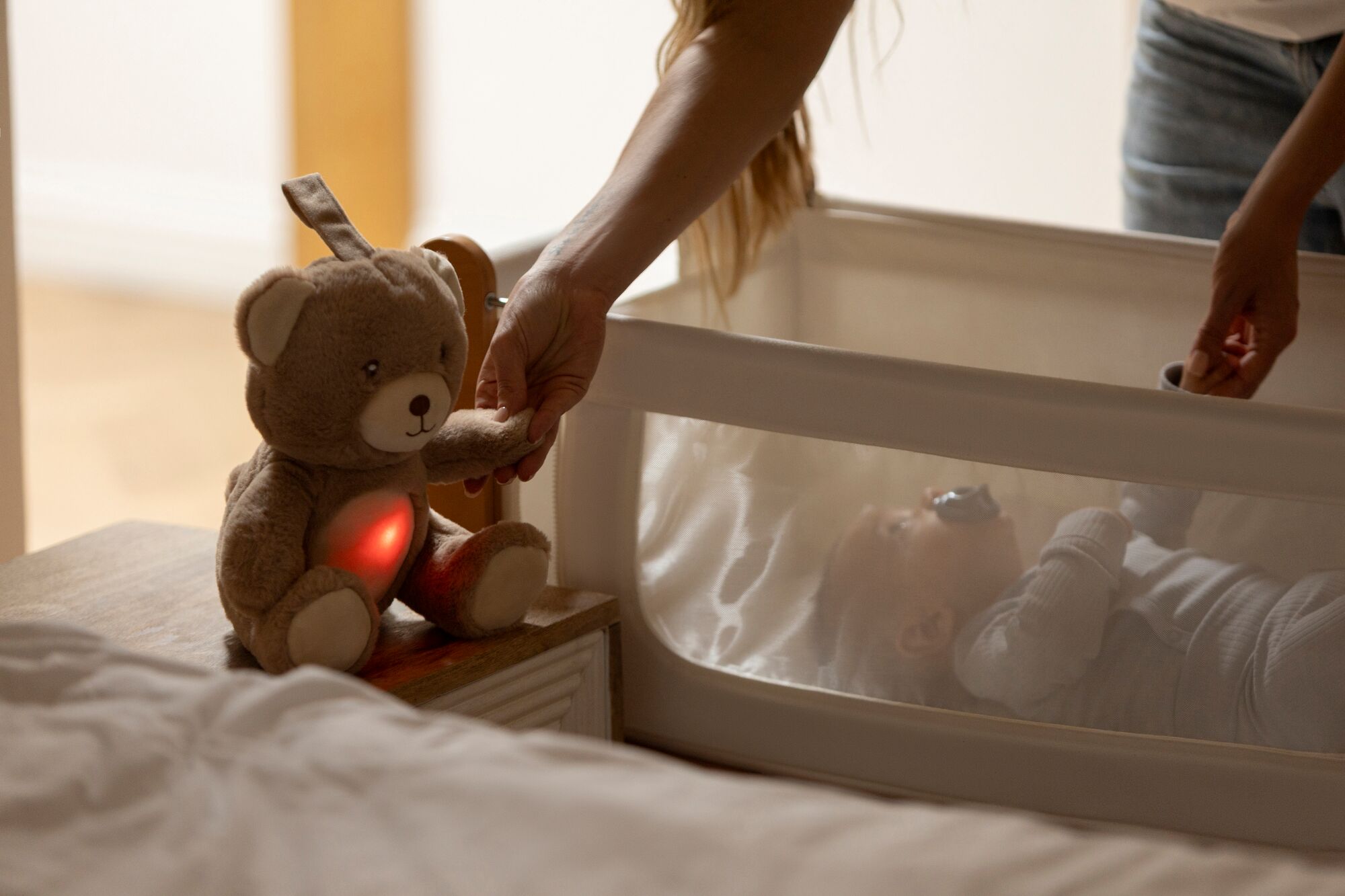 Bear sleep aid next to cot