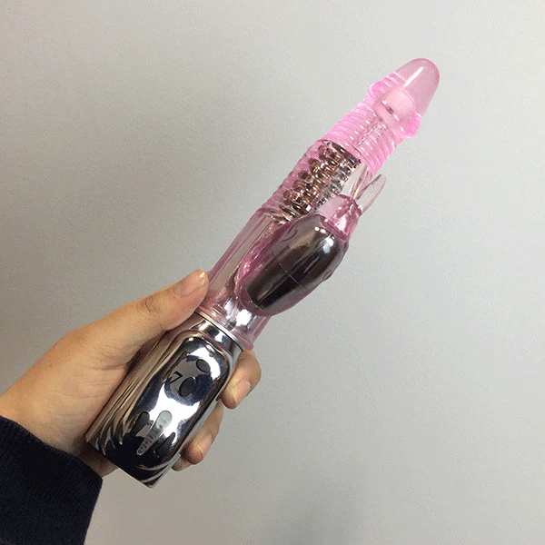 Rotating best selling dual-action rabbit vibe being held by hand