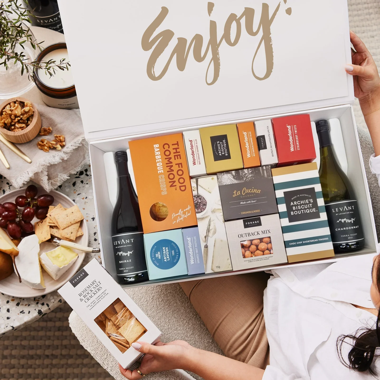 Gourmet hamper with wine, cheese and artisan snacks