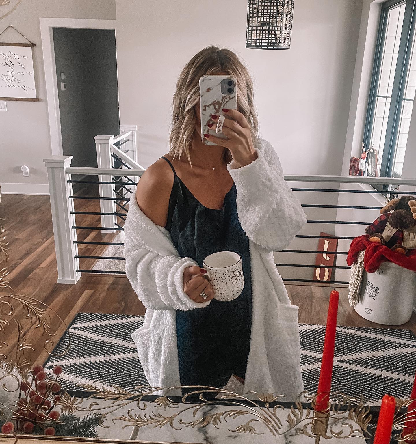 Washable Silk Sleep Dress worn by a Woman taking a selfie in a mirror with a staircase behind