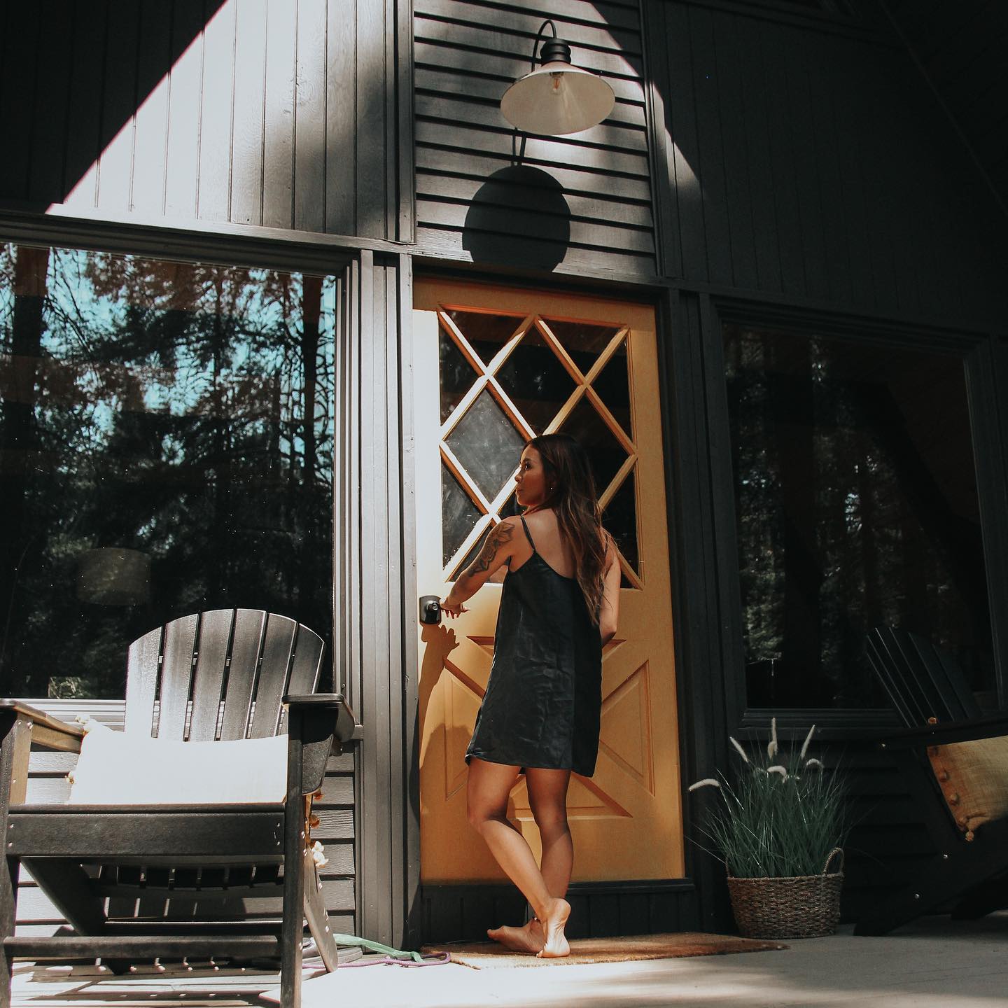 Women Wearing a Black Washable Silk Sleep Dress Opening a Door 