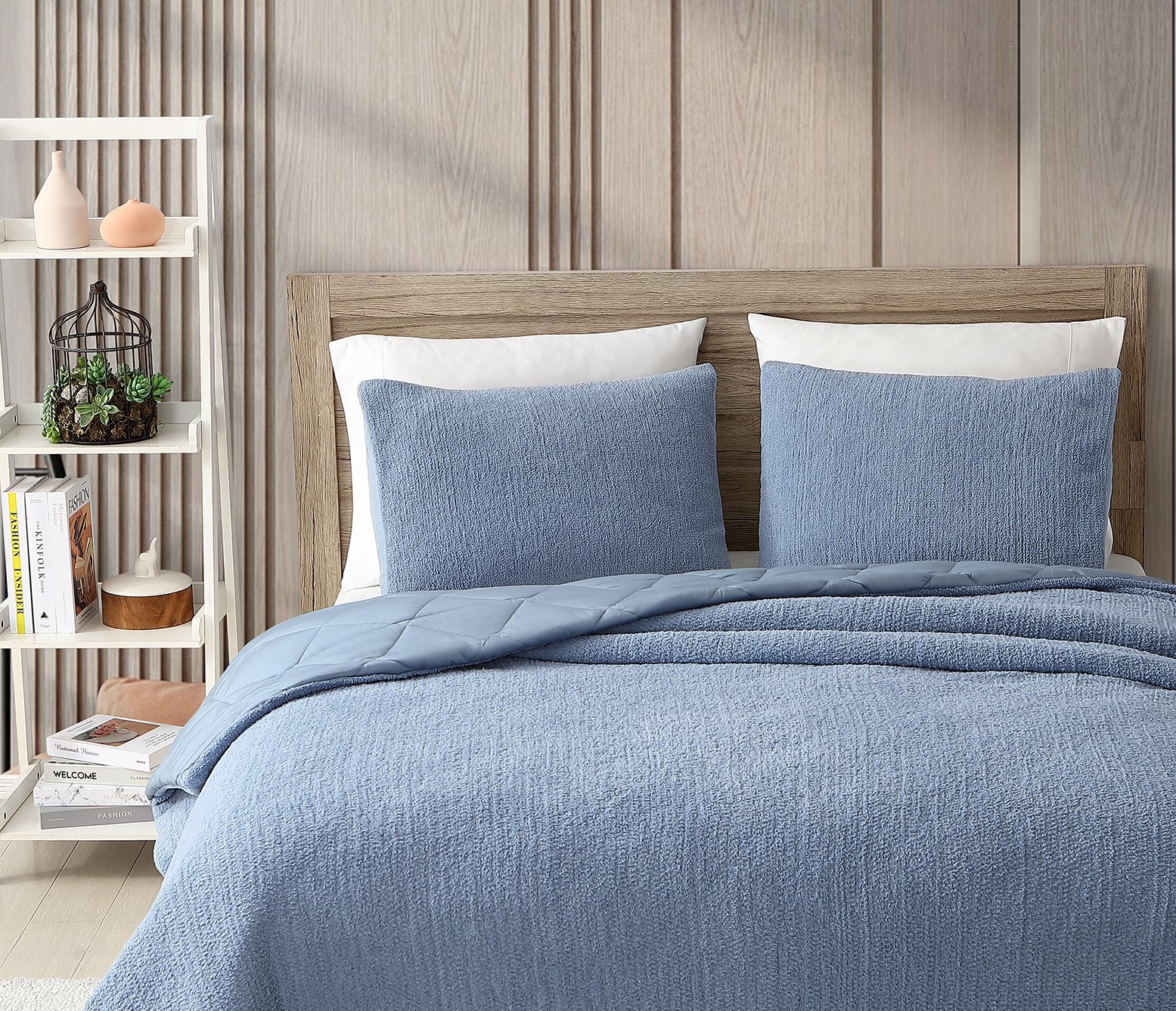 What is a Sham? Sunday Citizen's Snug + Bamboo Sham Set in Denim. Snug Comforter in Denim. Simple bed with four pillows and a fuzzy blue comforter. Blue bed.
