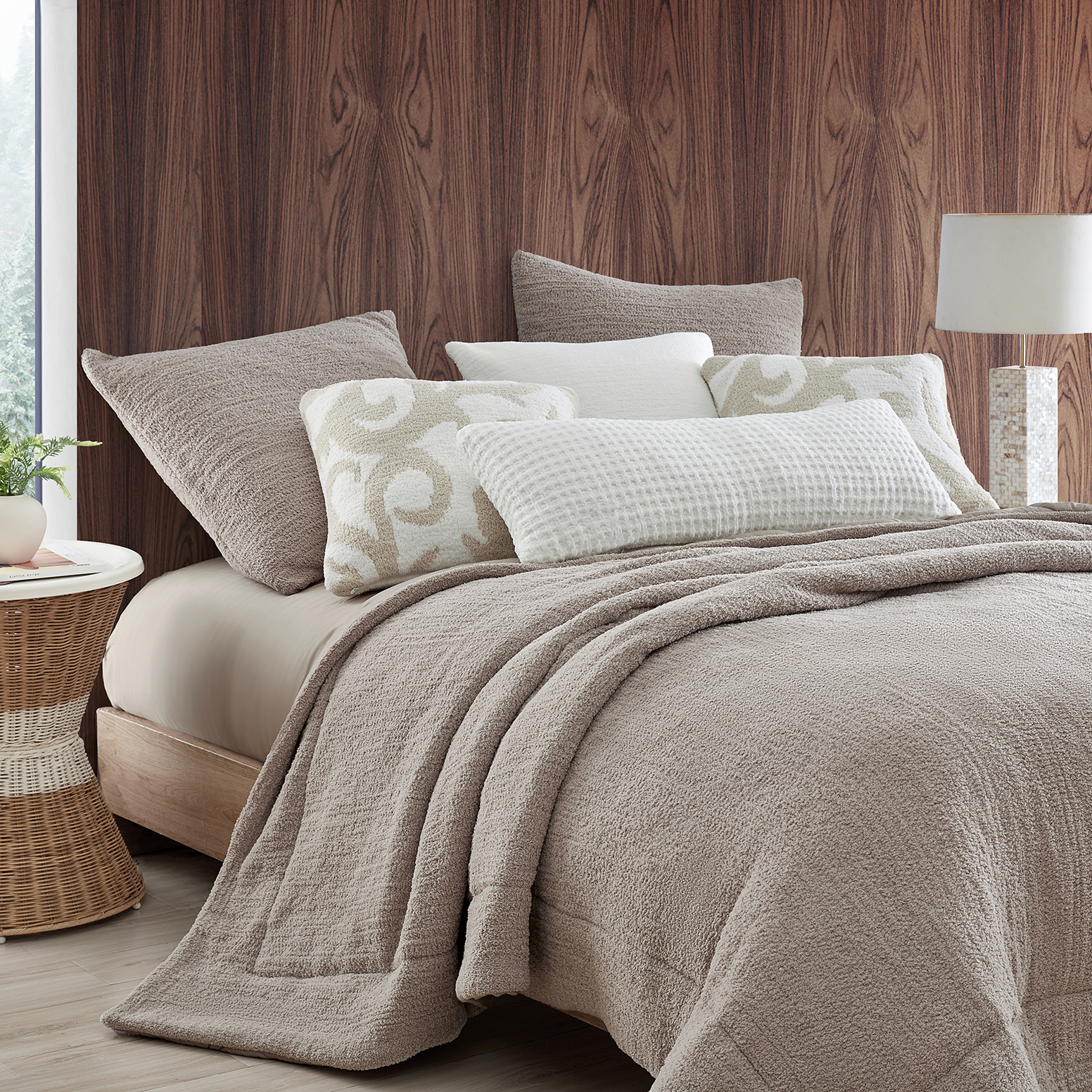What is a Pillow Sham? Sunday Citizen's Snug Comforter in Taupe. Snug Euro Sham in Taupe. Sunday Citizen patterned throw pillows. Taupe colored bed with lots of different pillows.
